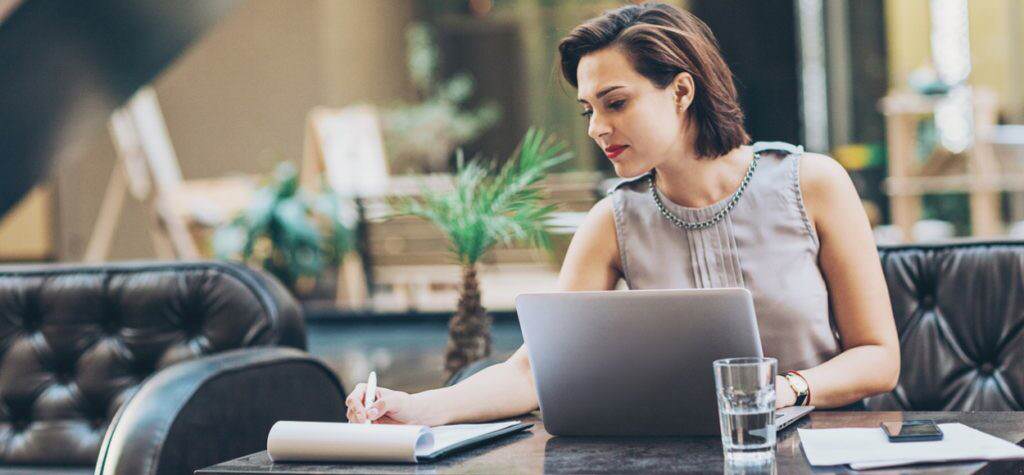 Woman writing at desk