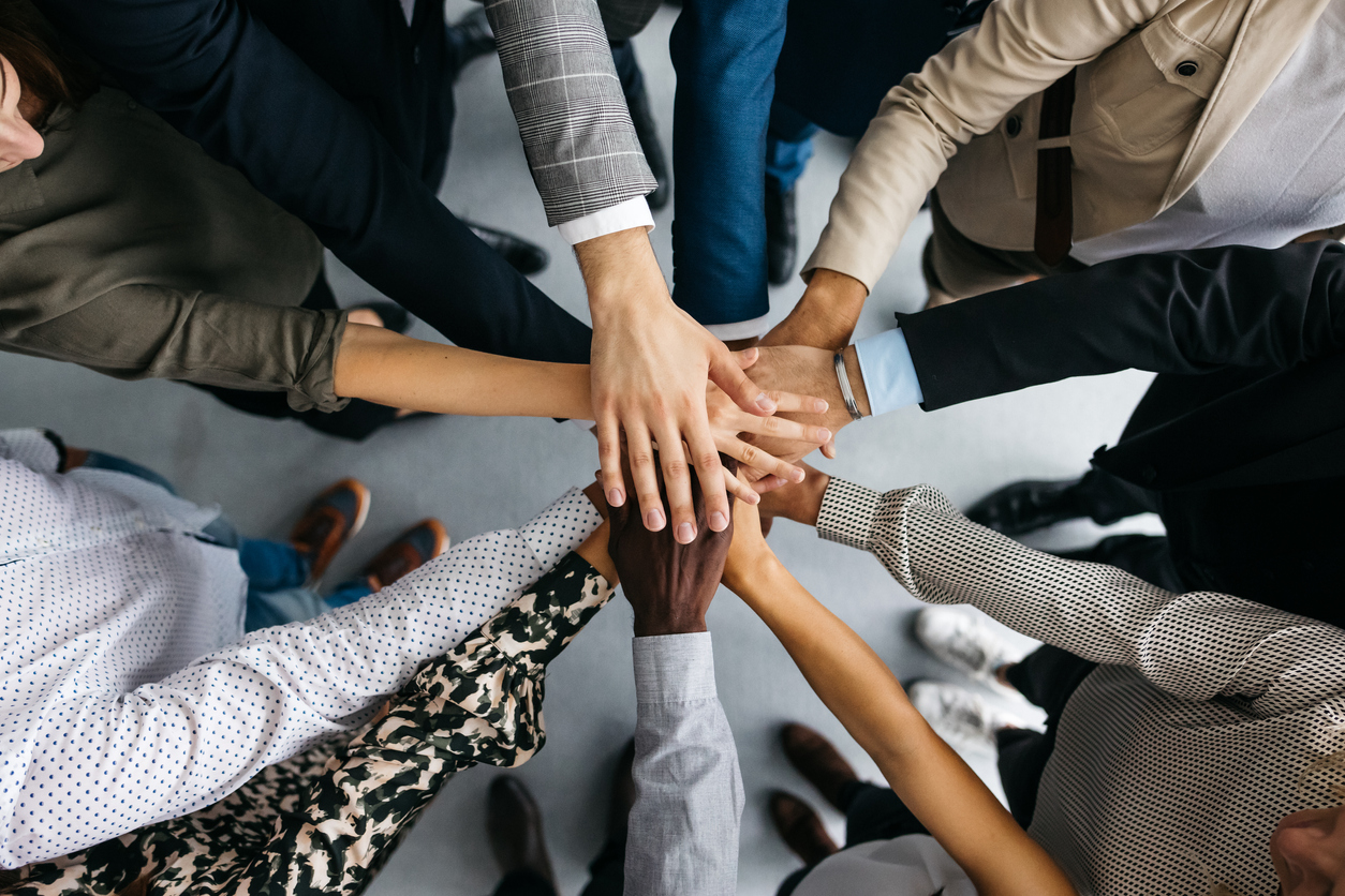 Group of hands coming together