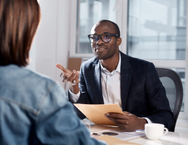 Male boss speaking to prospect employee