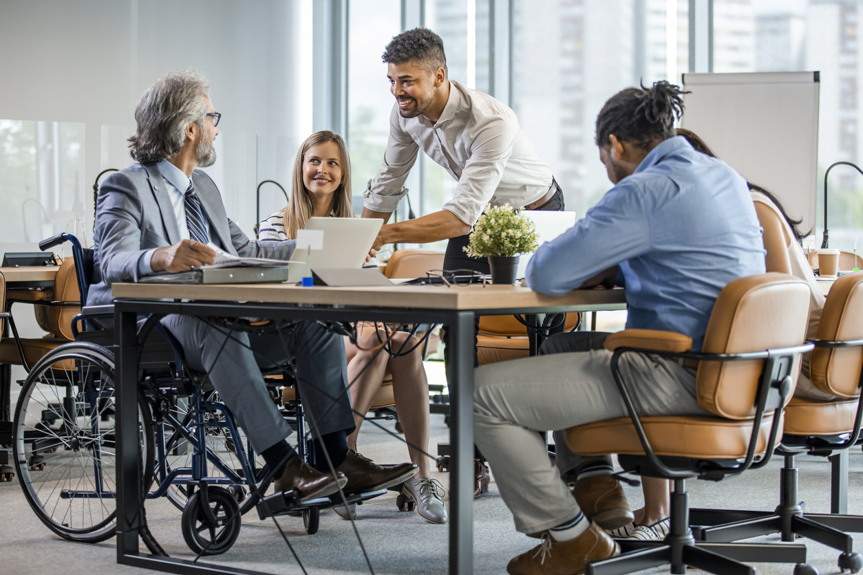 Mixed group of employees in a meeting