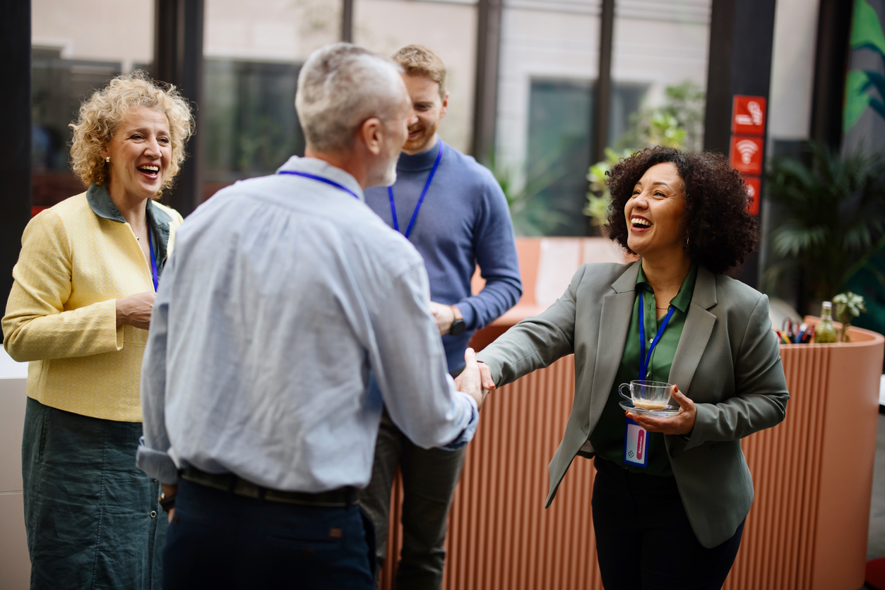 male and female business people introducing each other