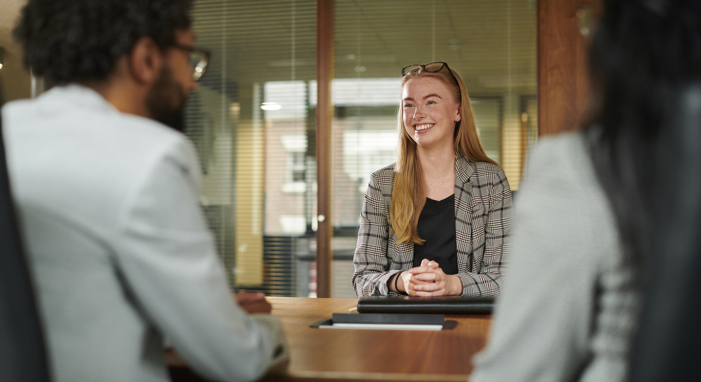 Two employees interviewing a prospect