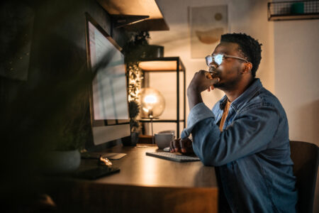 Male employee working late into the night