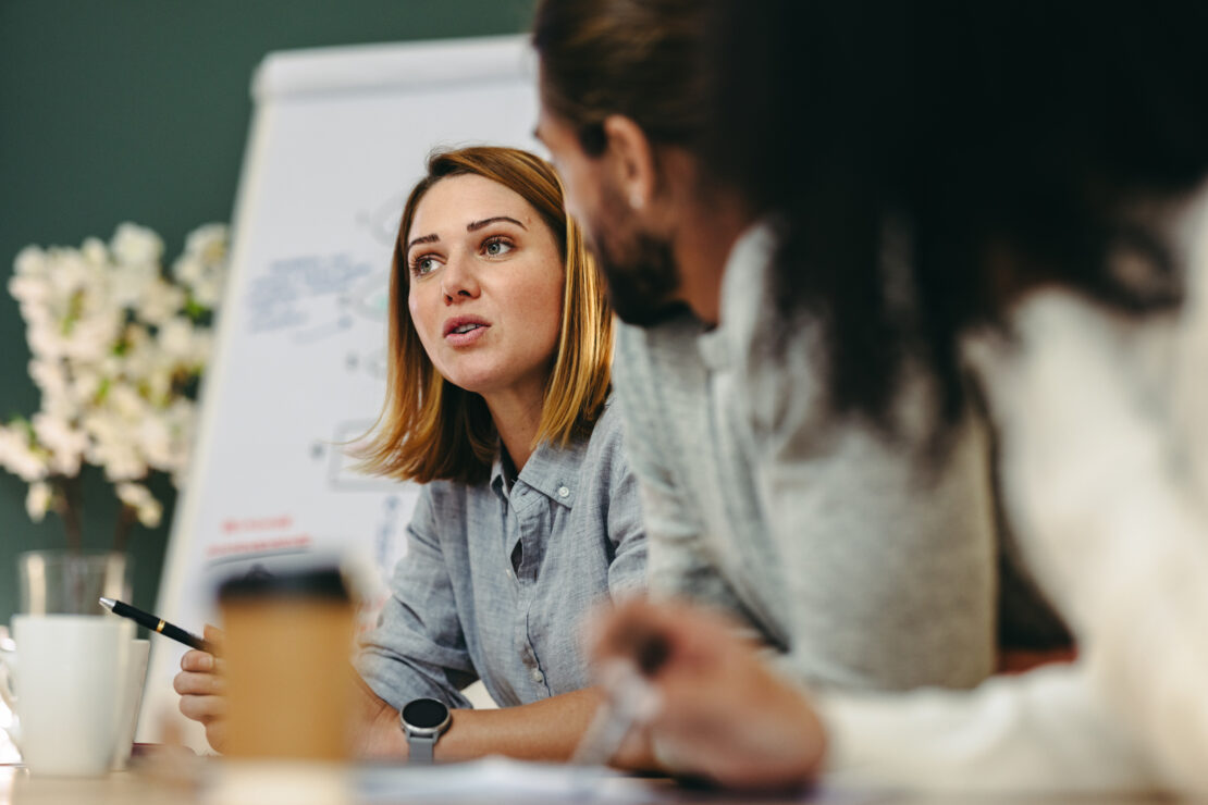 Zoomed in photo of a women in a meeting