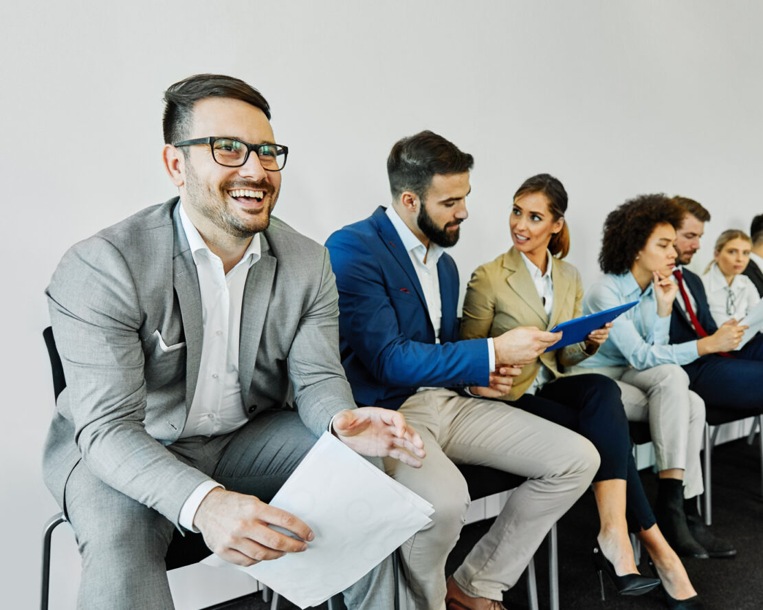 Line of possible candidates awaiting a job interview