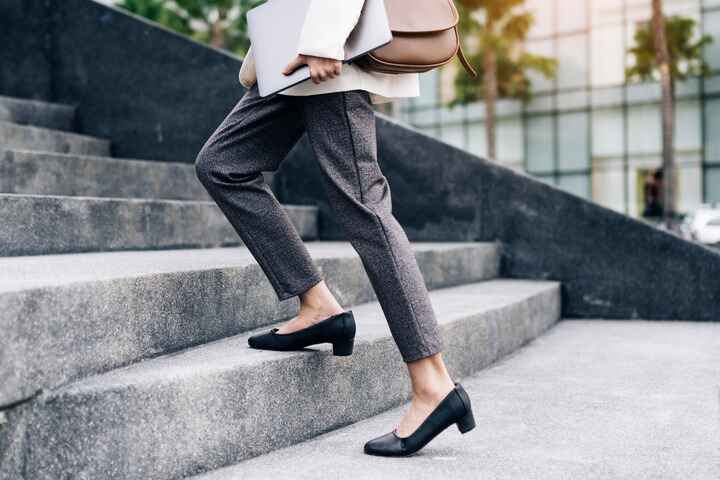 Women stepping up on stone steps