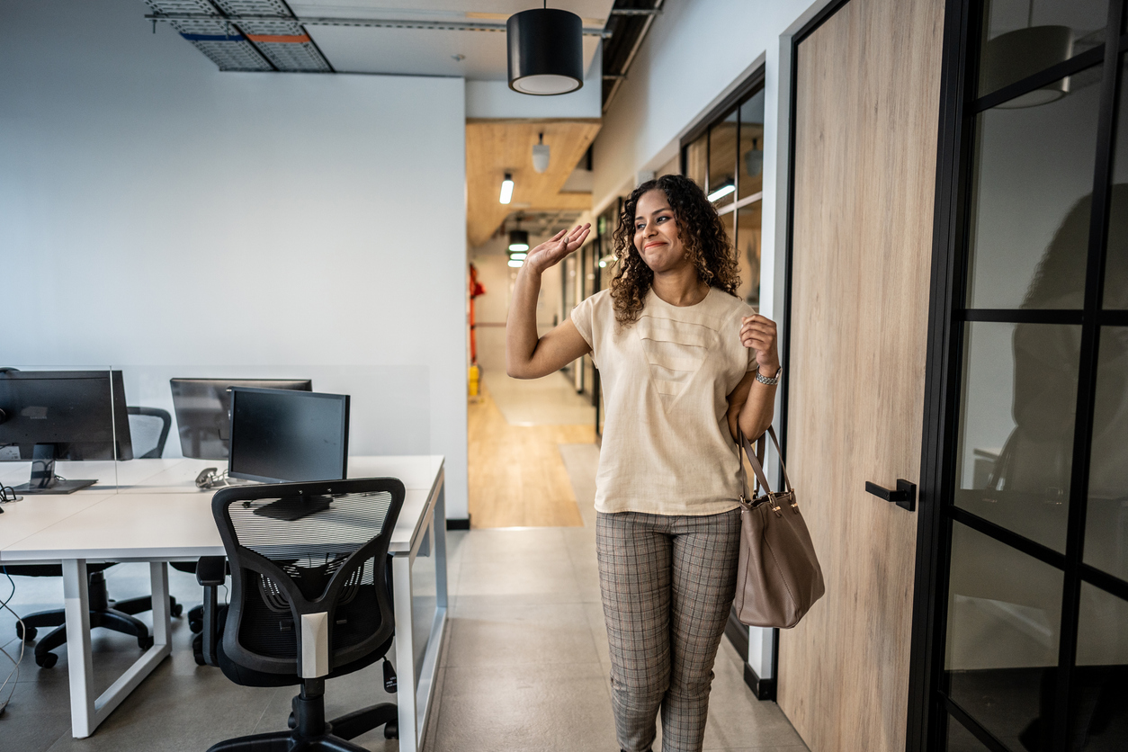 Mid adult woman arrives at the office